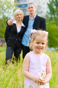 photo of little girl with parents